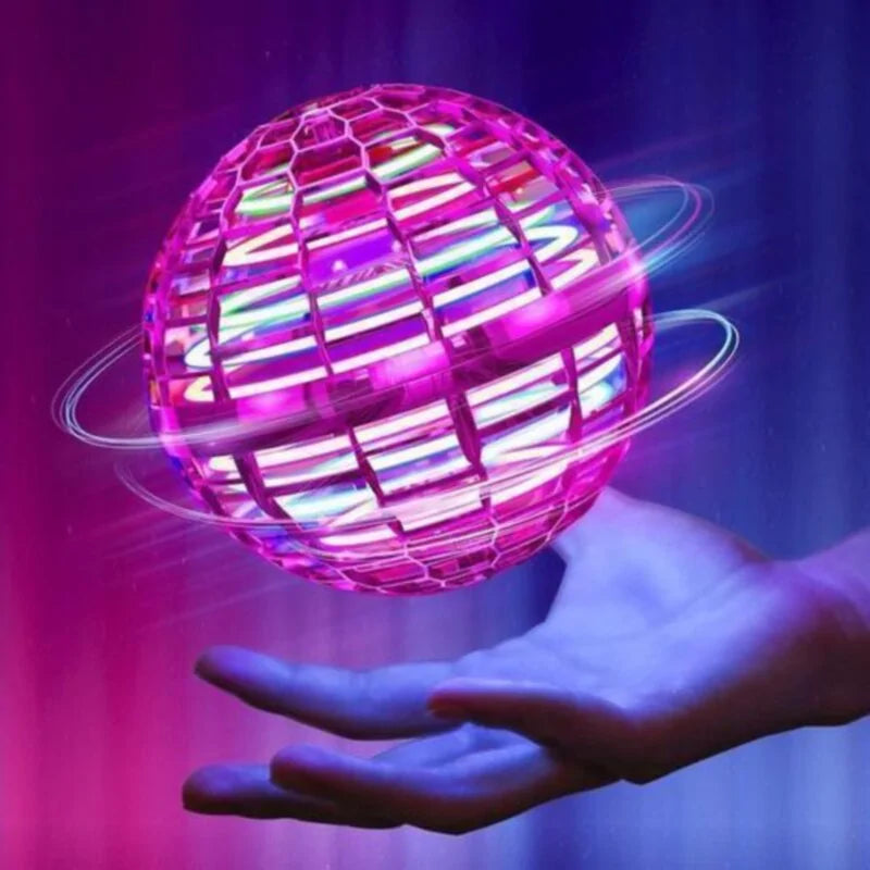 Colorful LED Hoverball mini drone toy levitating above a hand.