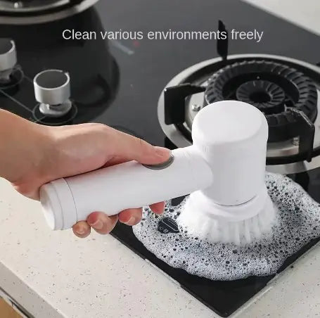 5-in-1 Magic Scrubber with interchangeable head cleaning a stovetop.